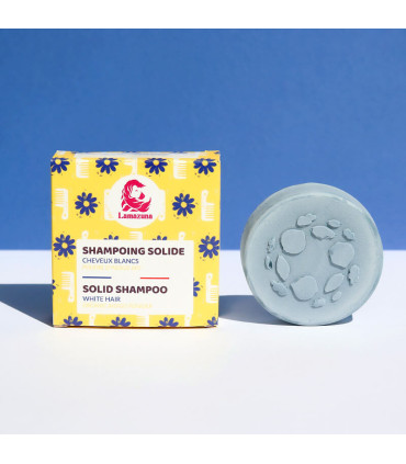 Champú sólido natural para cabellos blancos fuera de la caja sobre fondo azul
